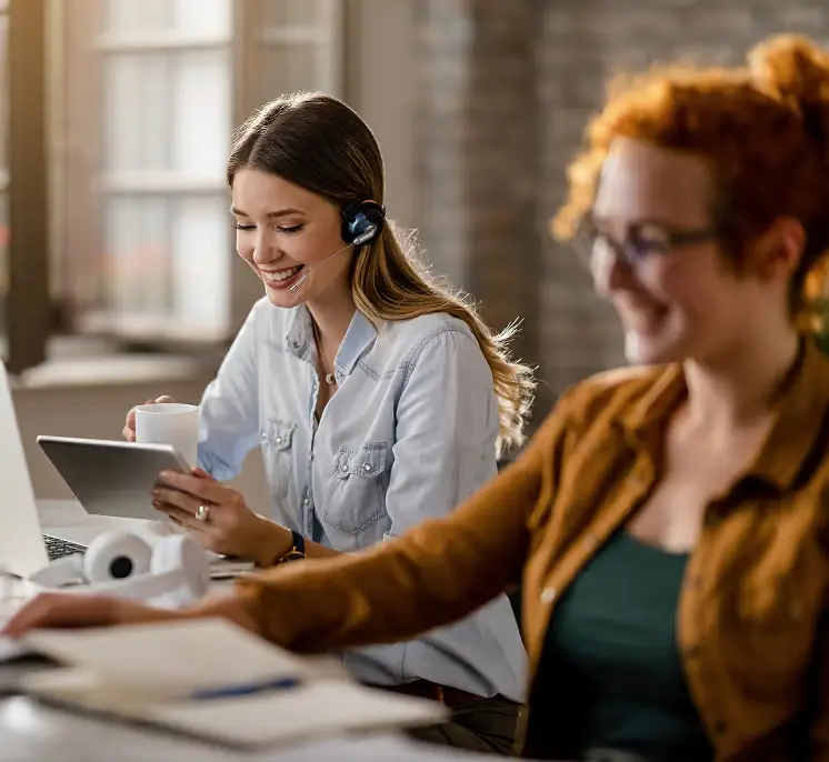 Two colleagues collaborating at a desk